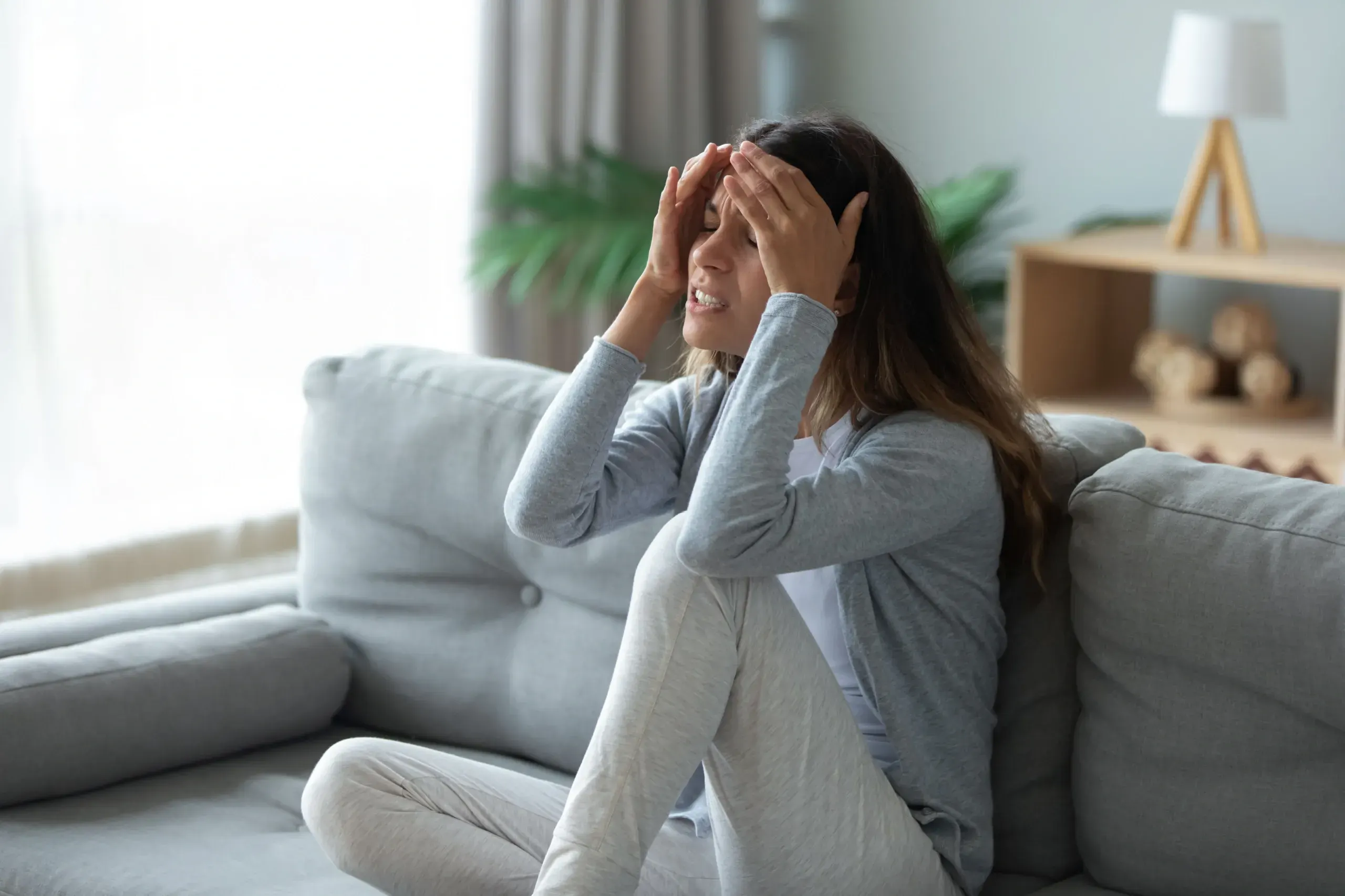 Close-up of patient experiencing migraine symptoms at Physicians Ketamine Institute of Destin