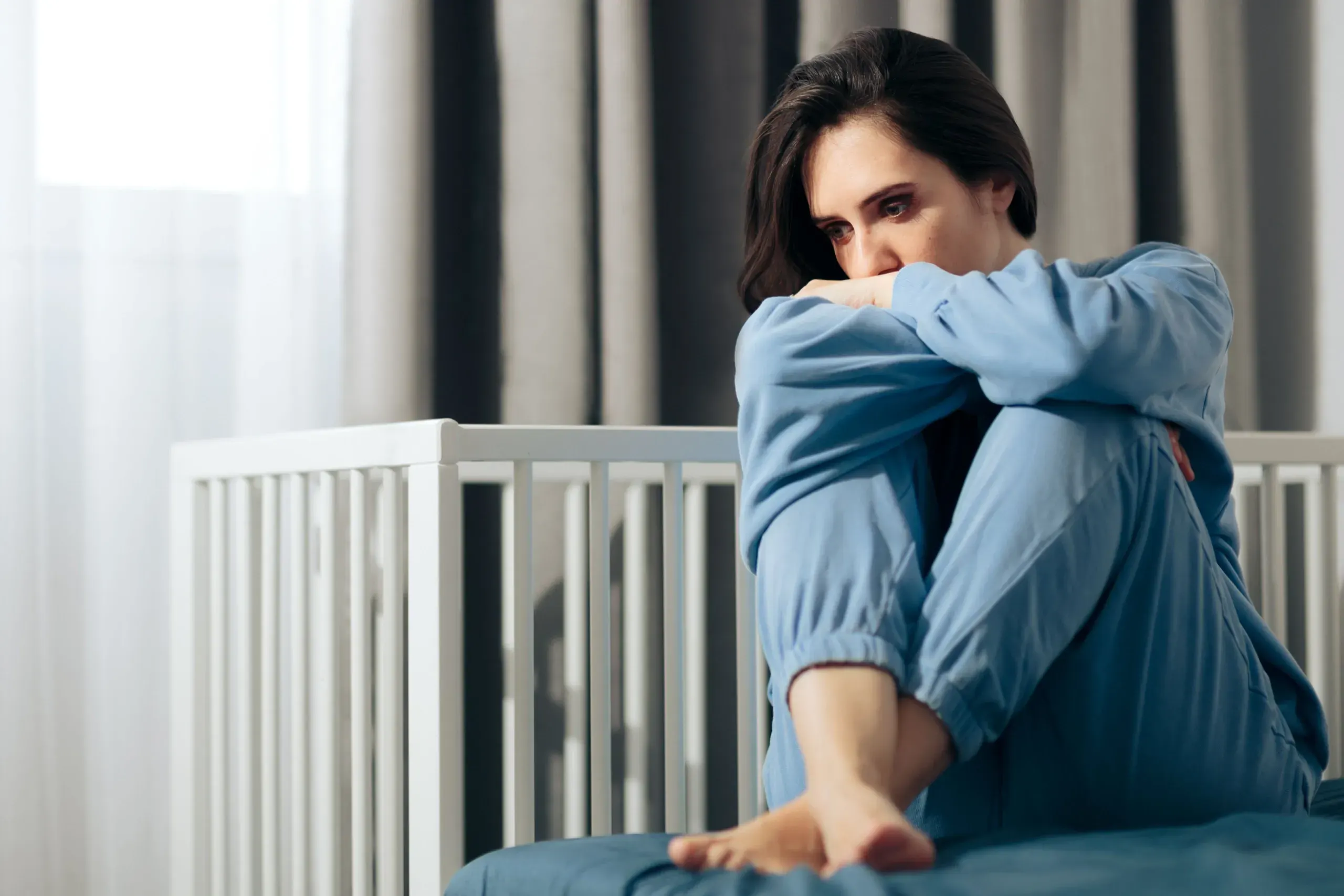 New mother seeking postpartum depression help at Physicians Ketamine Institute of Destin